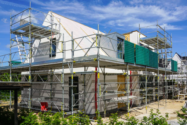 an-unfinished-modern-single-family-residential-house-surrounded-by-scaffolding-3